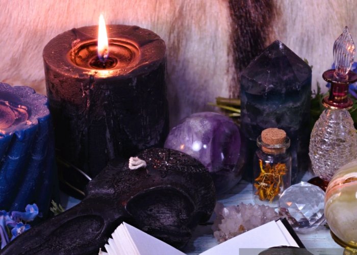 istockphoto-1321085685-2048×2048 Still life with open diary book, crystals, flowers and burning candles. Esoteric, gothic and occult background, Halloween mystic and wicca concept.